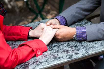 Holding Hands on Marble Table