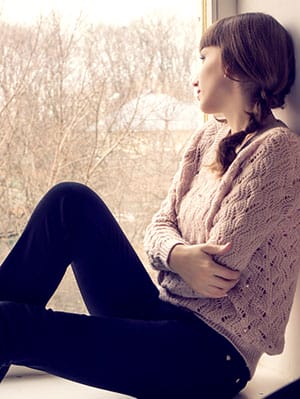 girl-sitting-at-window